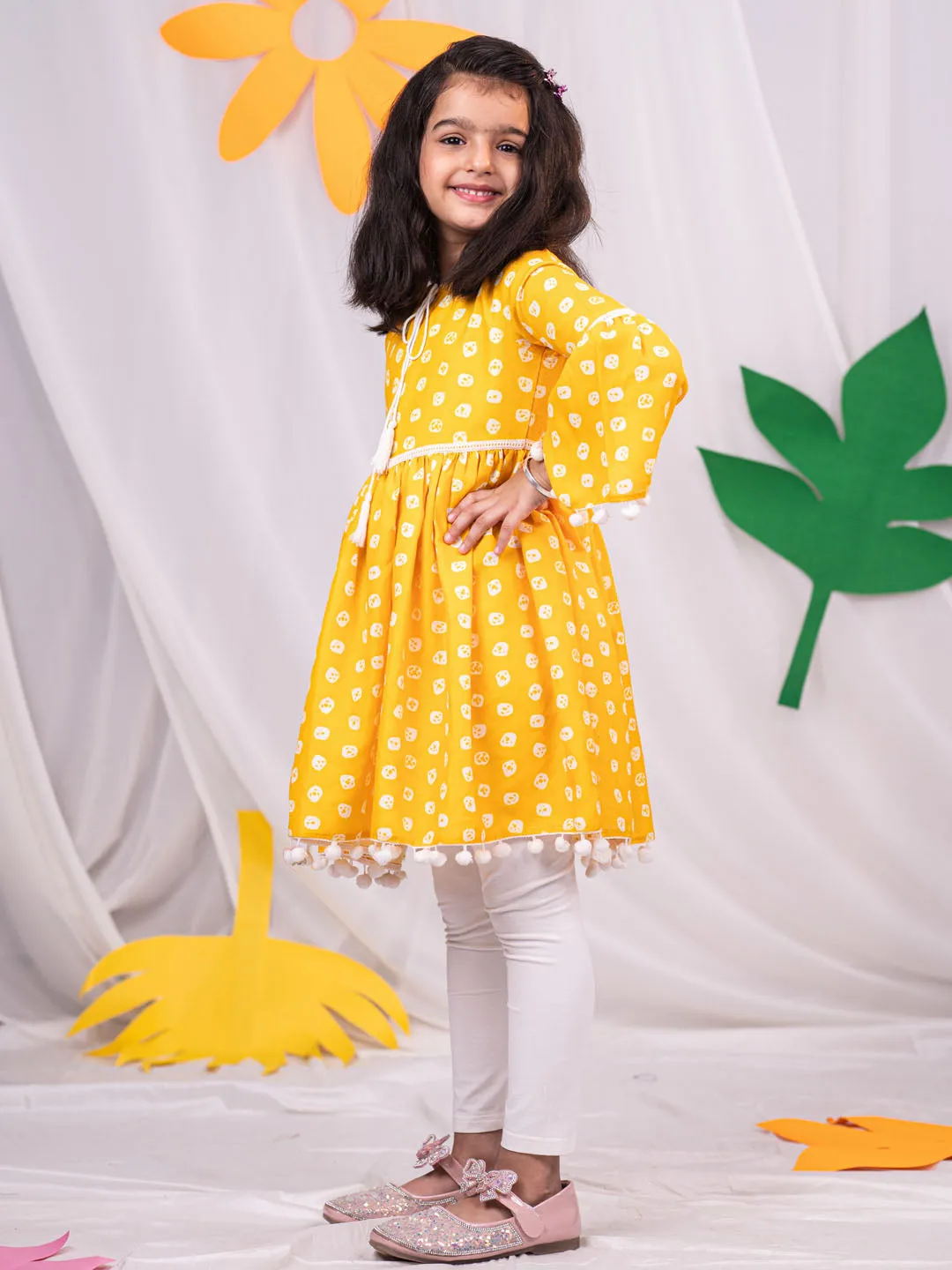 Jashvi Girl's Yellow Printed Ruffle Kurta With Leggings Set