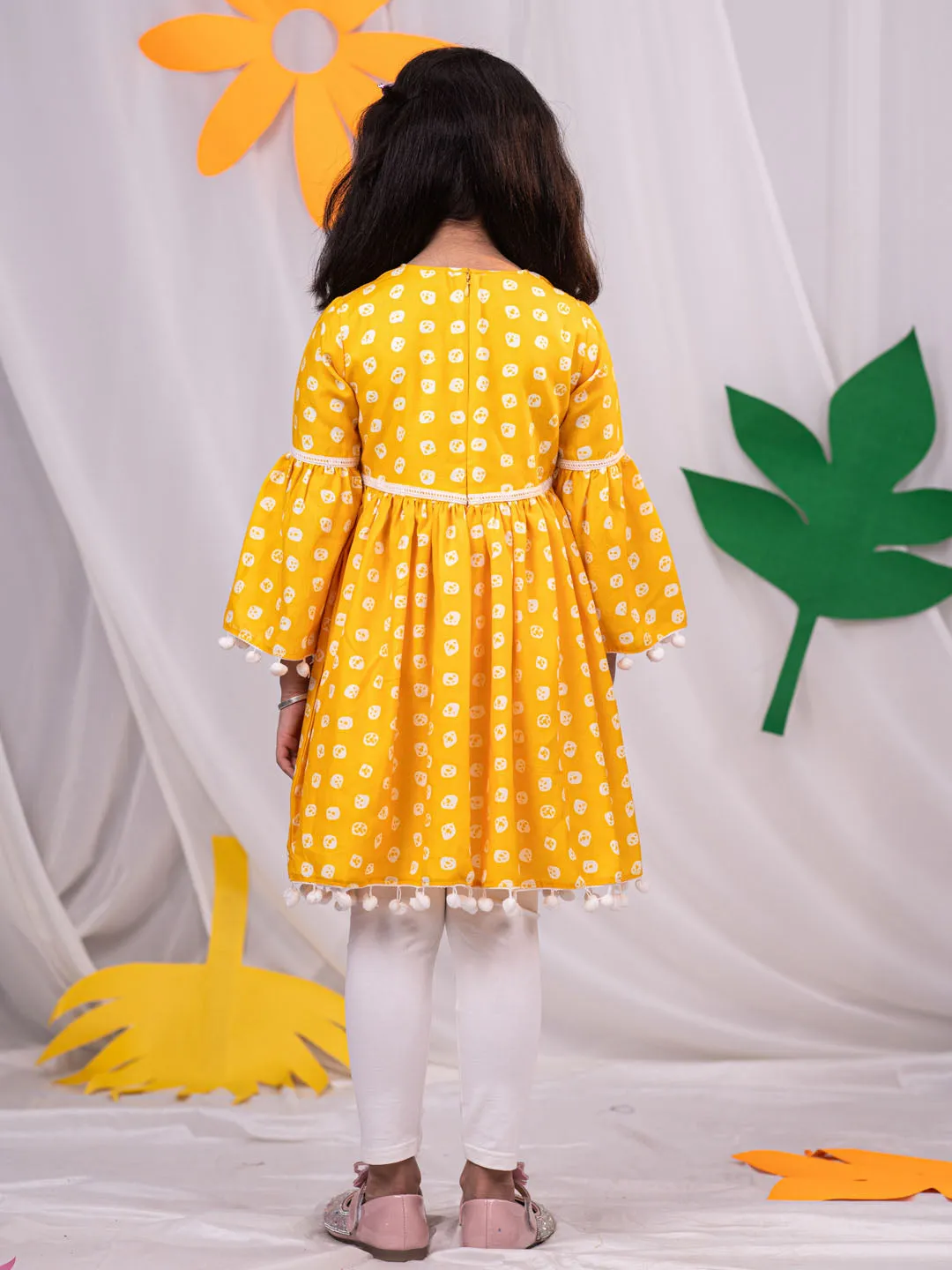 Jashvi Girl's Yellow Printed Ruffle Kurta With Leggings Set