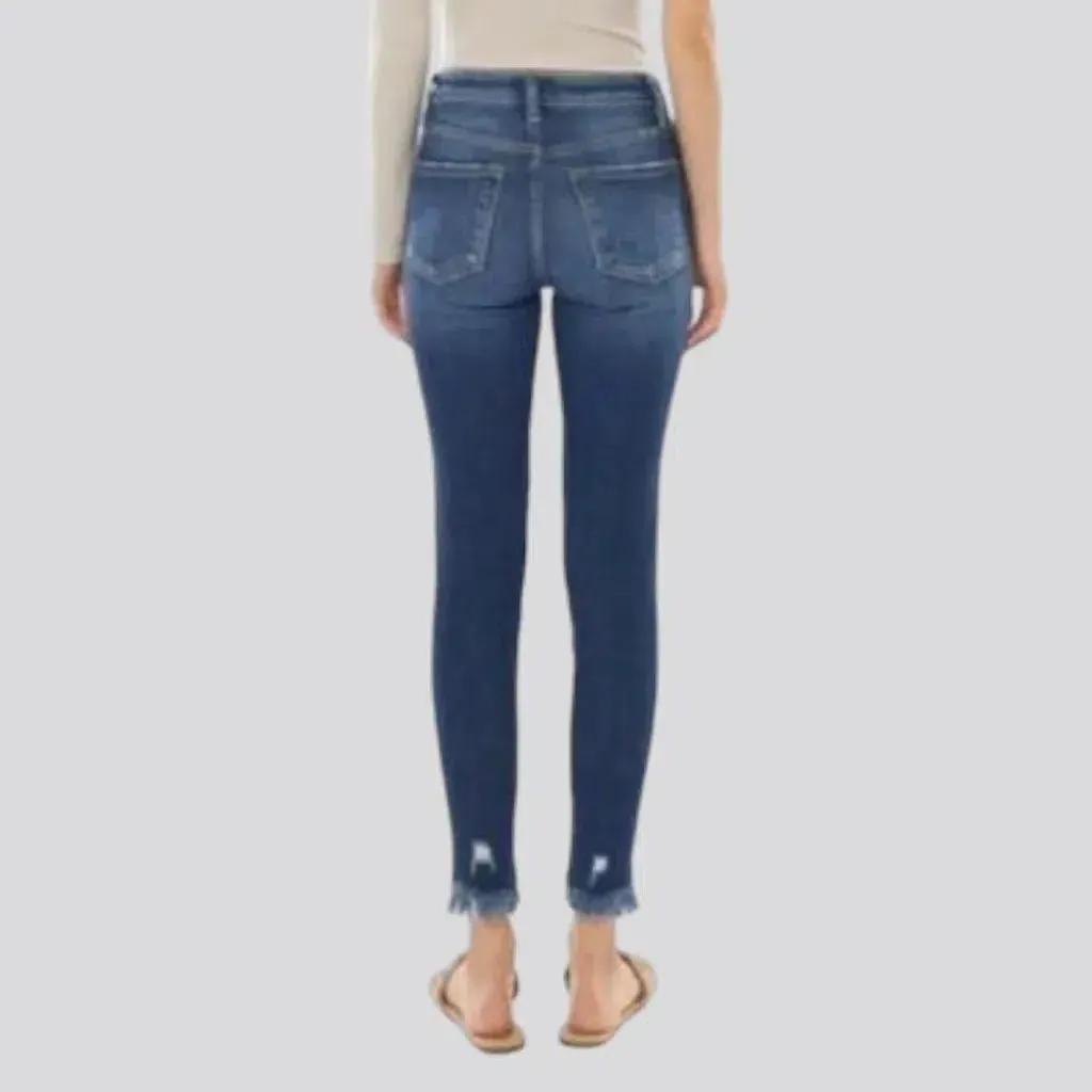 Medium-wash skinny jeans
 for ladies